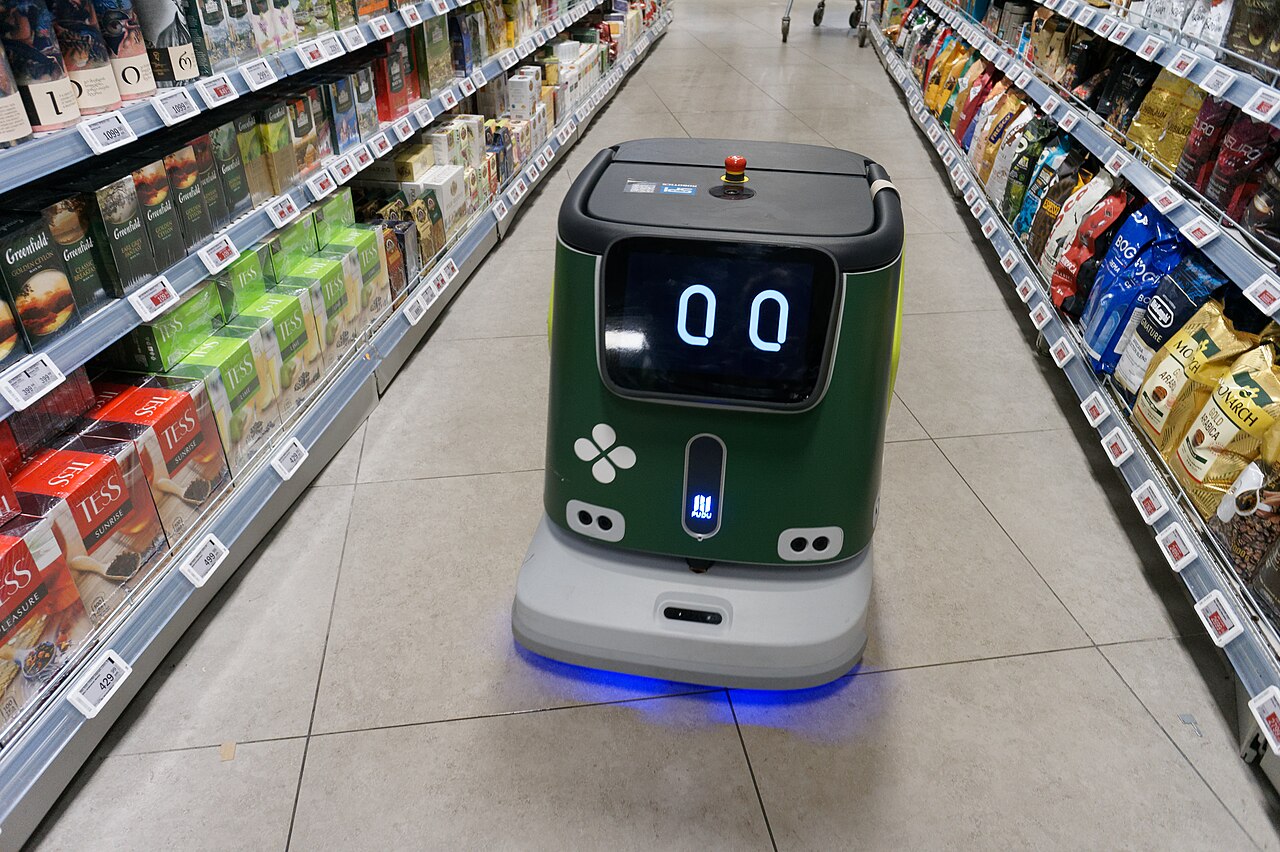 Pudu Robotics CC1: Front view while cleaning a supermarket aisle in Moscow, 2025